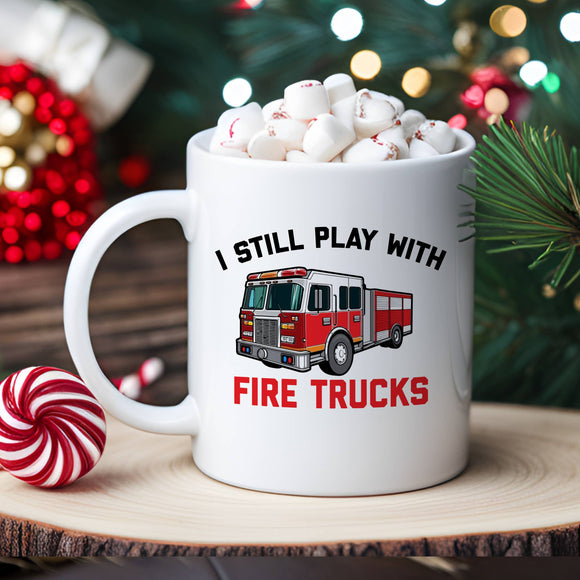 I Still Play With Fire Trucks Coffee Mug